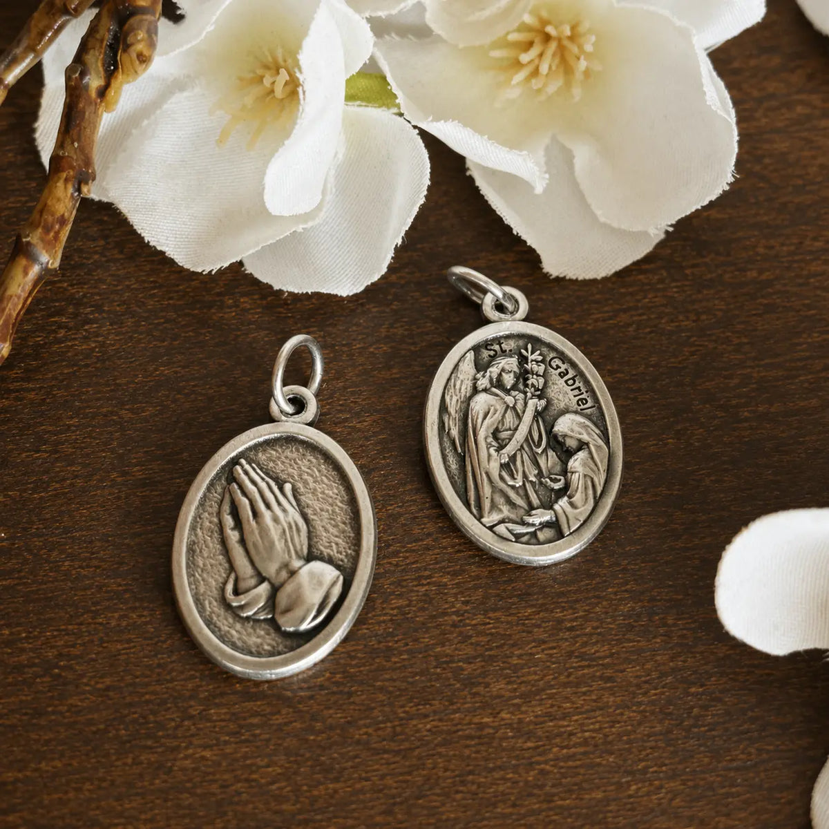 Double-sided Archangel Gabriel Religious Medal featuring the Annunciation on the front and praying hands on the reverse