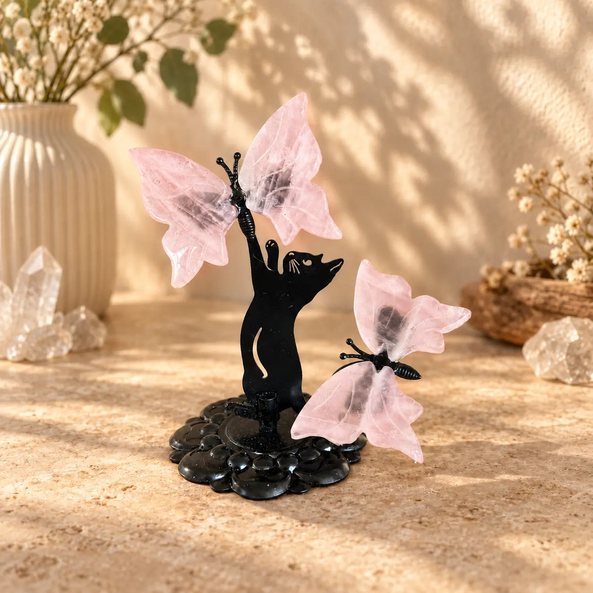 Rose Quartz butterfly crystal sculpture with two butterflies on black cat stand