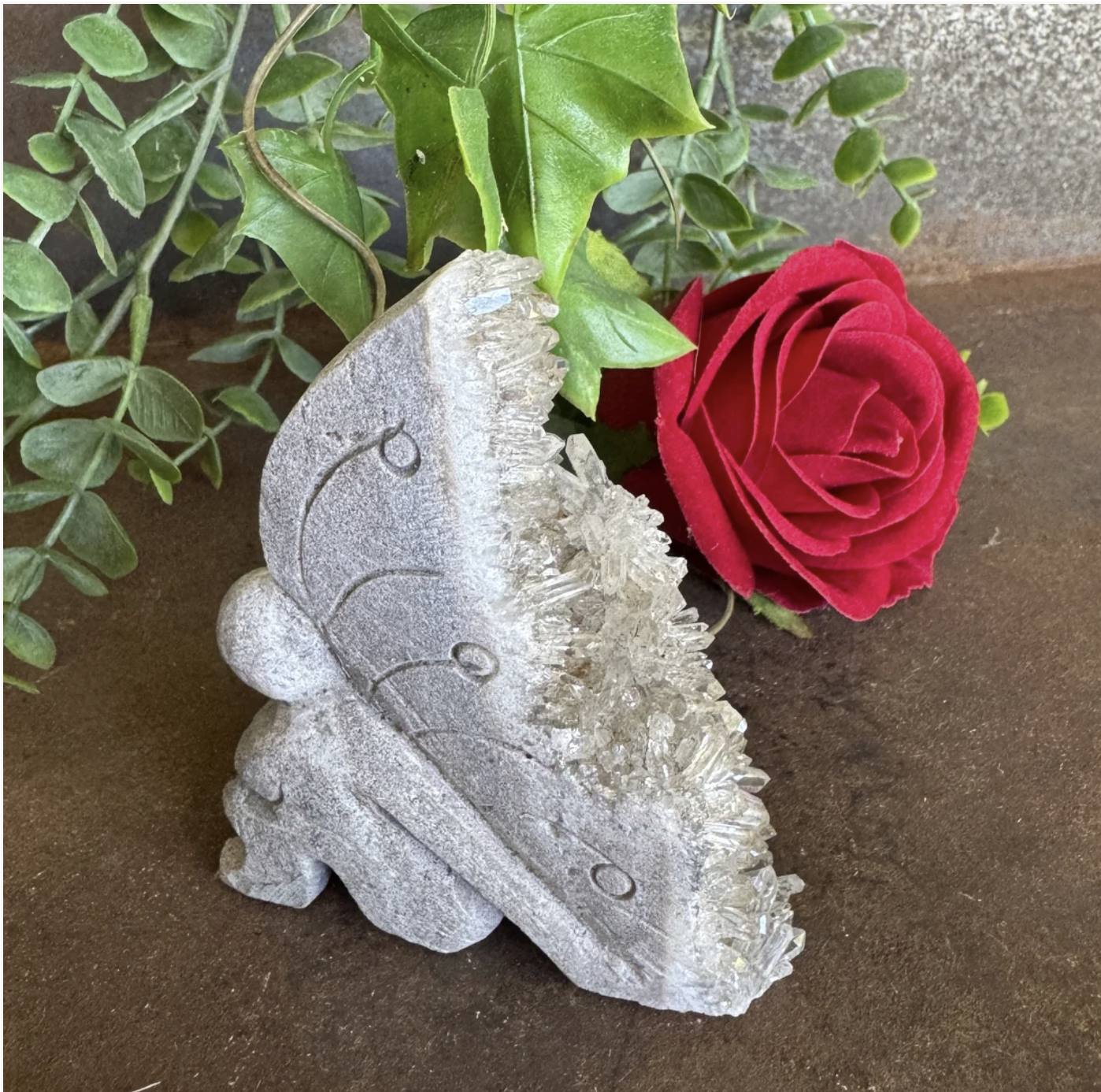 Quartz Fairy Geode Carving 137g – silver-grey Quartz fairy geode carving approx 9cm tall with dense clear white crystal point formation along full right wing edge