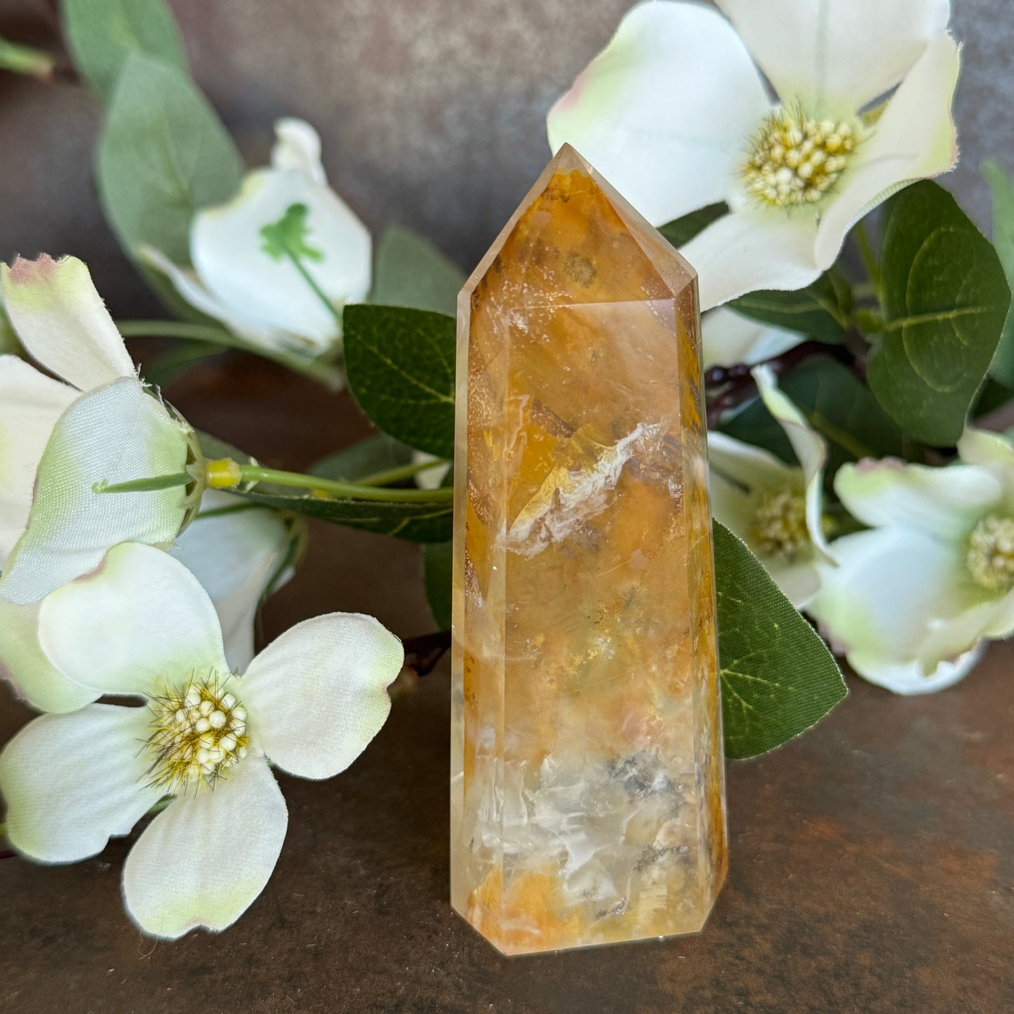 129g · 95mm
Golden Healer Quartz Tower, 129g and 95mm tall, with a pale clear body and golden-amber branch-like mineral patterning