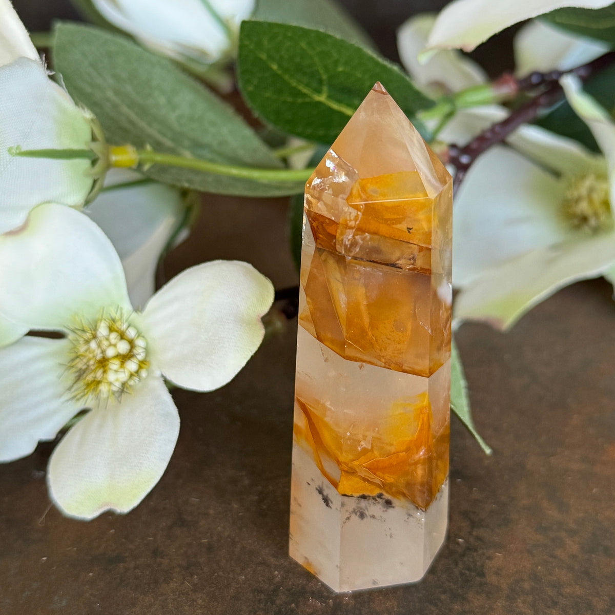 53g · 72mm
Golden Healer Quartz Tower, 53g and 72mm tall, with clear and amber-orange banding and natural mineral inclusions