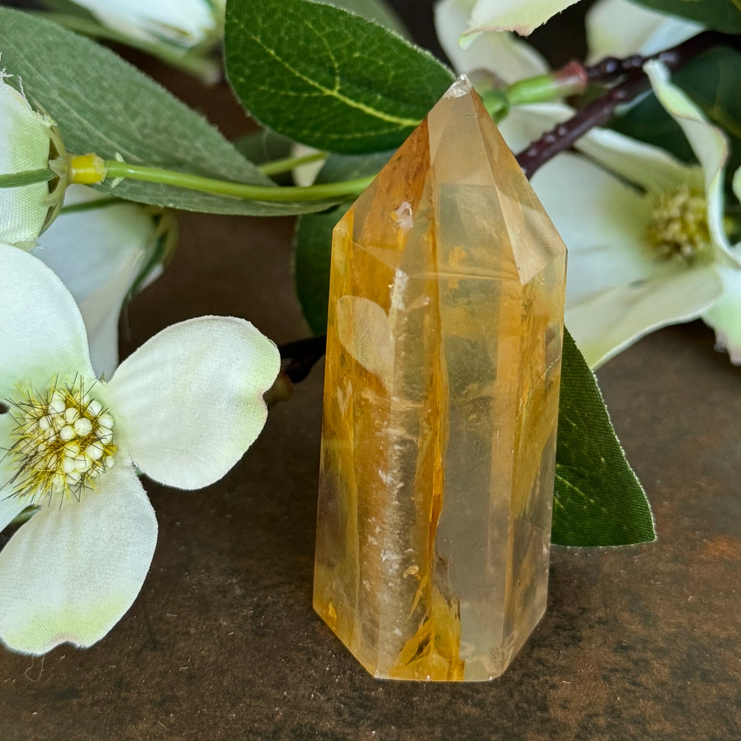 79g · 69mm
Golden Healer Quartz Tower, 79g and 69mm tall, with a warm amber-orange body and natural internal patterning