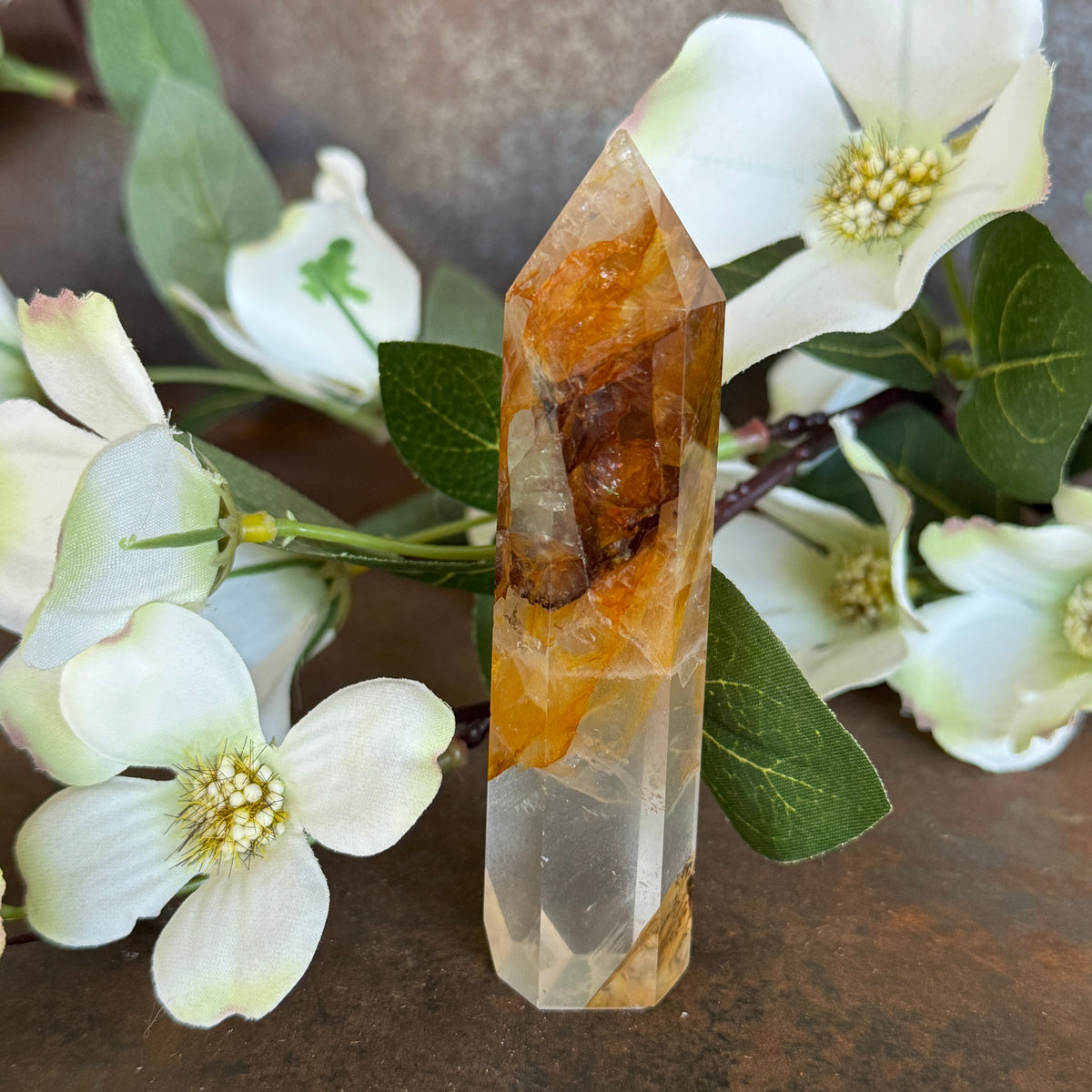 83g · 98mm
Golden Healer Quartz Tower, 83g and 98mm tall, with rich golden-orange colouring and white mineral inclusions