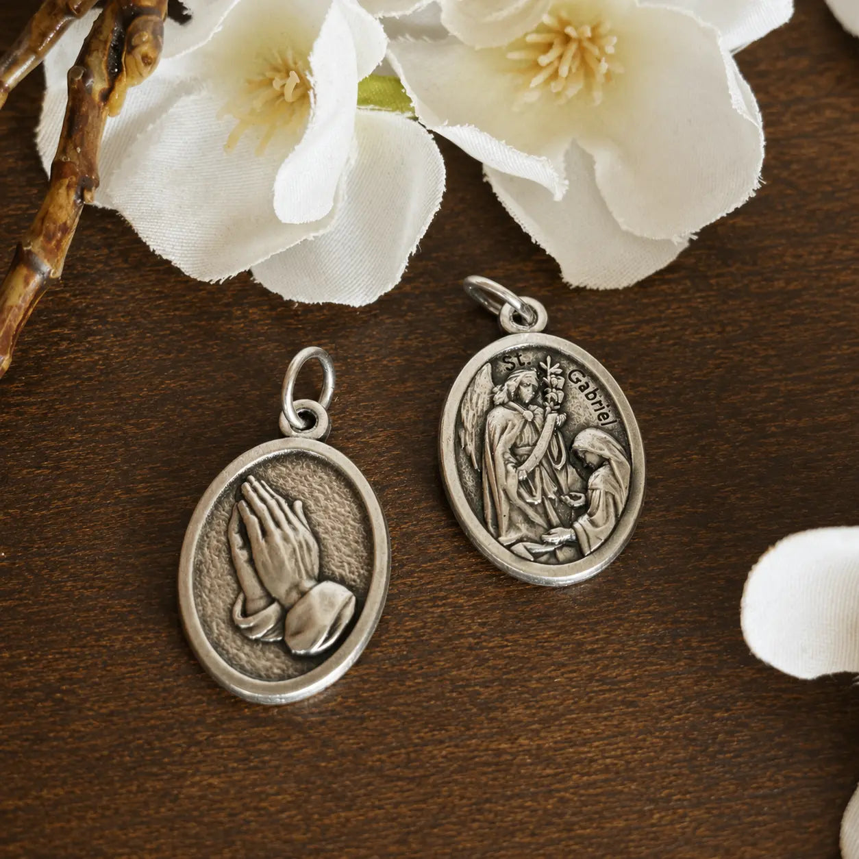 Double-sided Archangel Gabriel Religious Medal featuring the Annunciation on the front and praying hands on the reverse