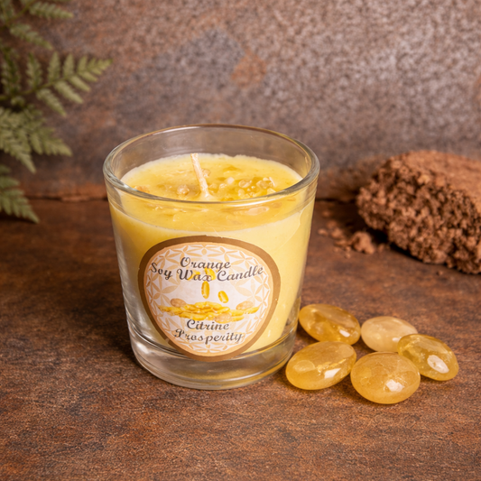 Glass candle with a label on a textured surface with decorative elements