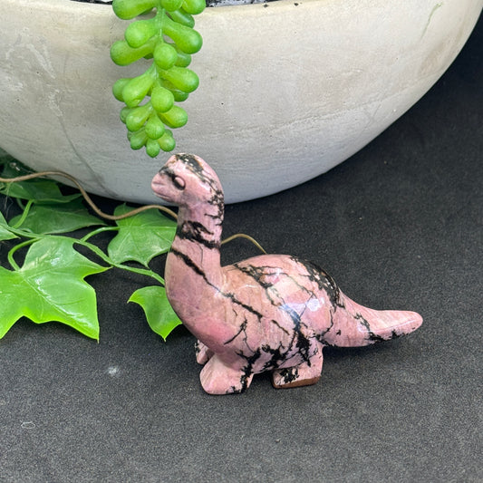 Rhodonite crystal dinosaur carving approximately 7cm