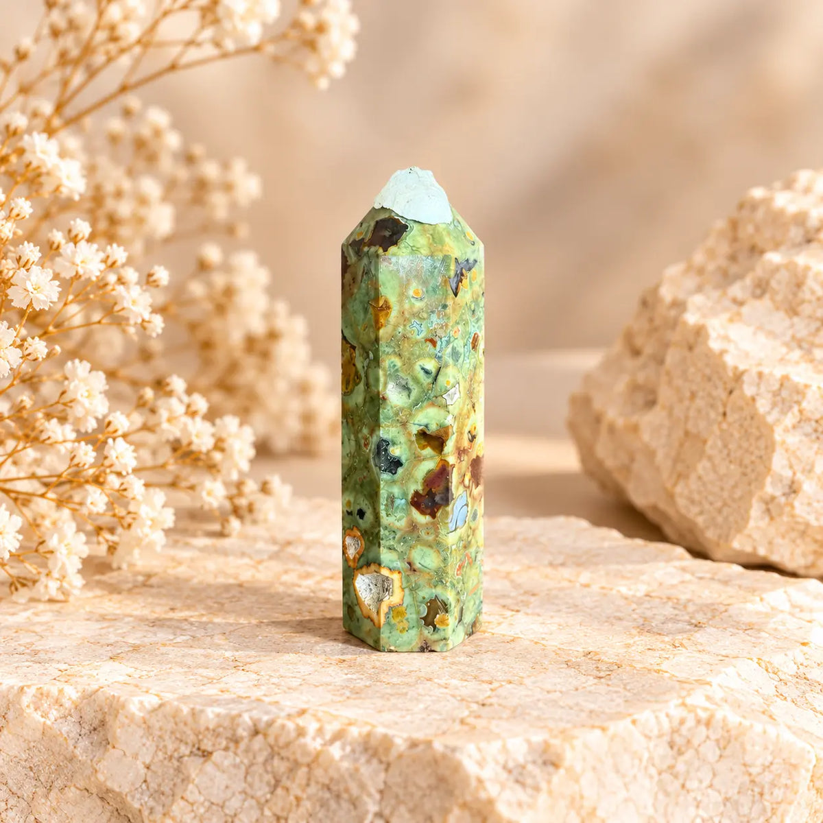 Green Rainforest Jasper crystal tower 88g approximately 8.7 x 2.3 cm with white protective tip cover