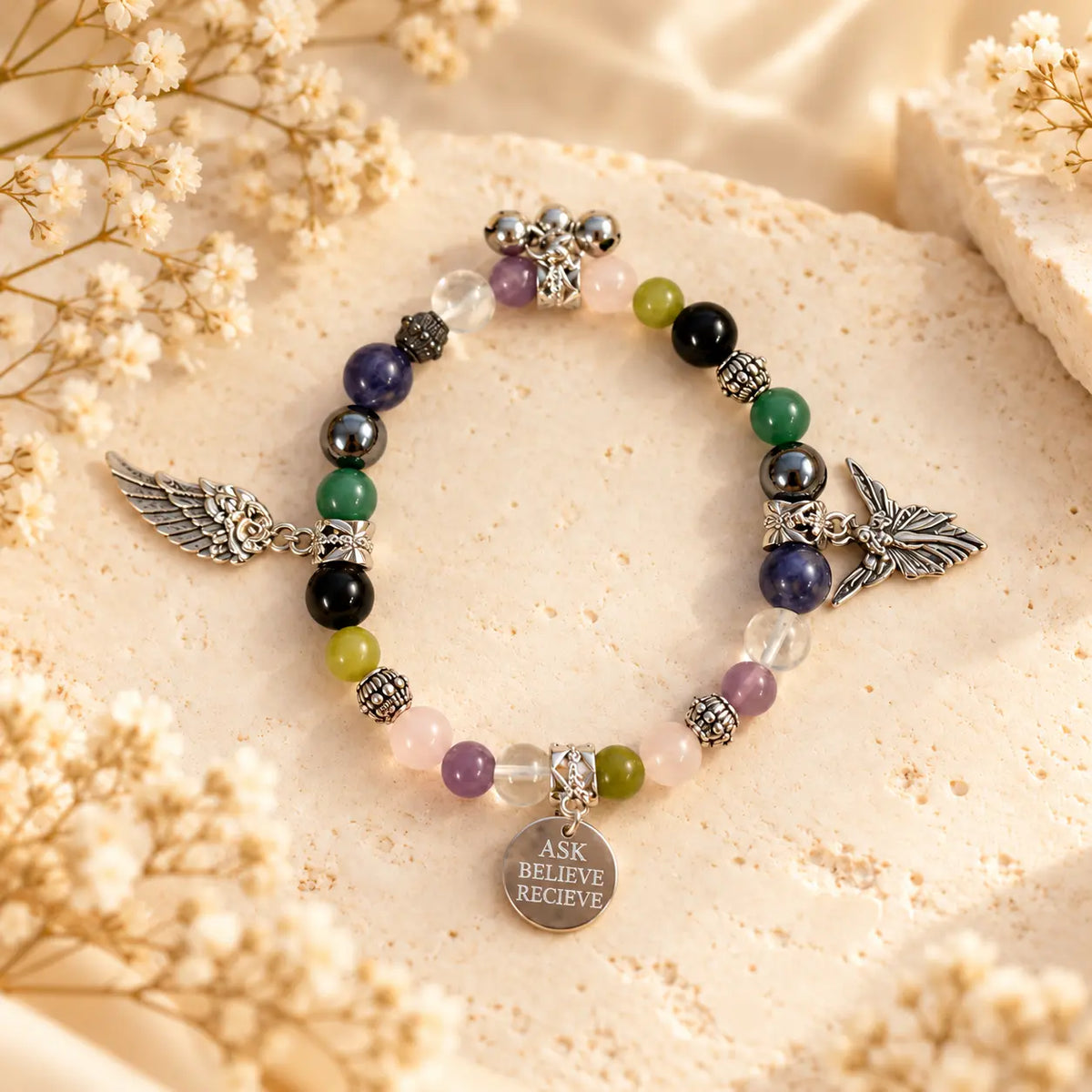 Heart Mind and Soul crystal bracelet with multicolour gemstone beads, silver angel wing charms and ASK BELIEVE RECIEVE affirmation pendant