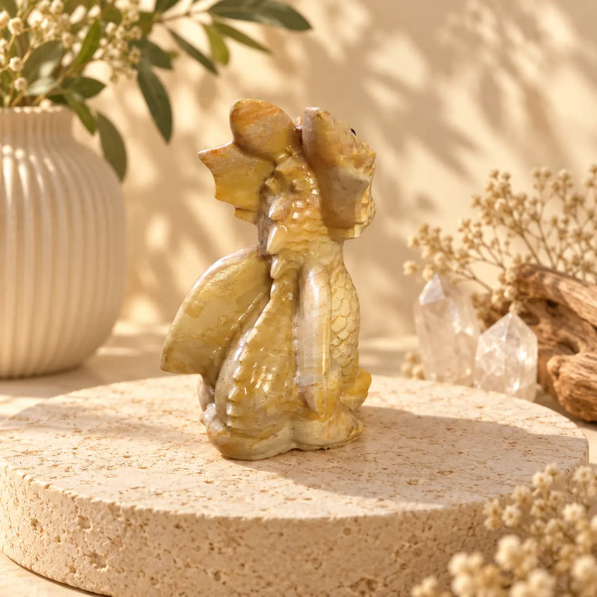 Hand-carved Jade crystal dragon showing natural stone variation