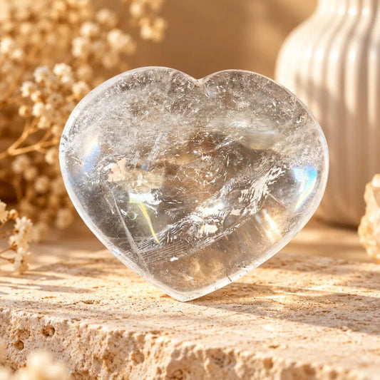 Large polished Clear Quartz crystal heart front view showing natural clear and cloudy inclusions, 10.5 cm wide