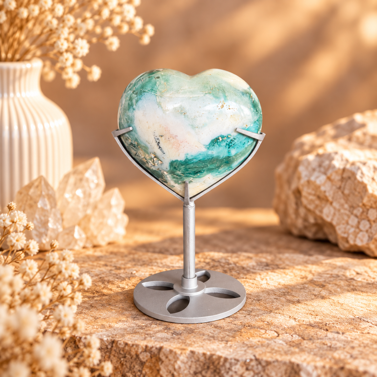 Ocean Jasper heart on silver stand with natural orbicular patterning