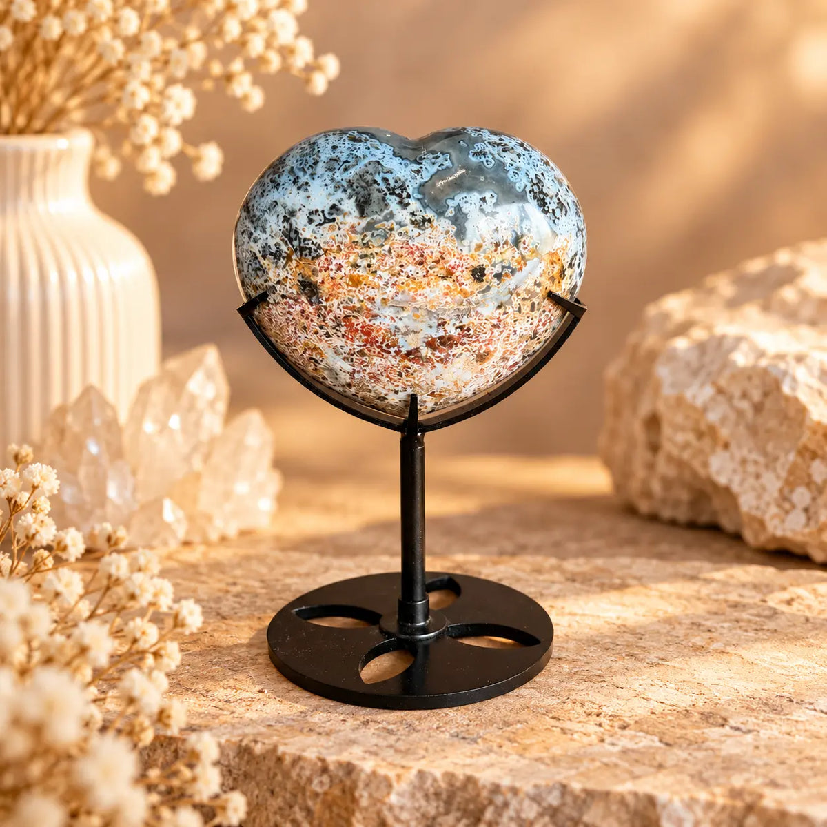 Natural Ocean Jasper crystal heart on dark stand – Piece 2