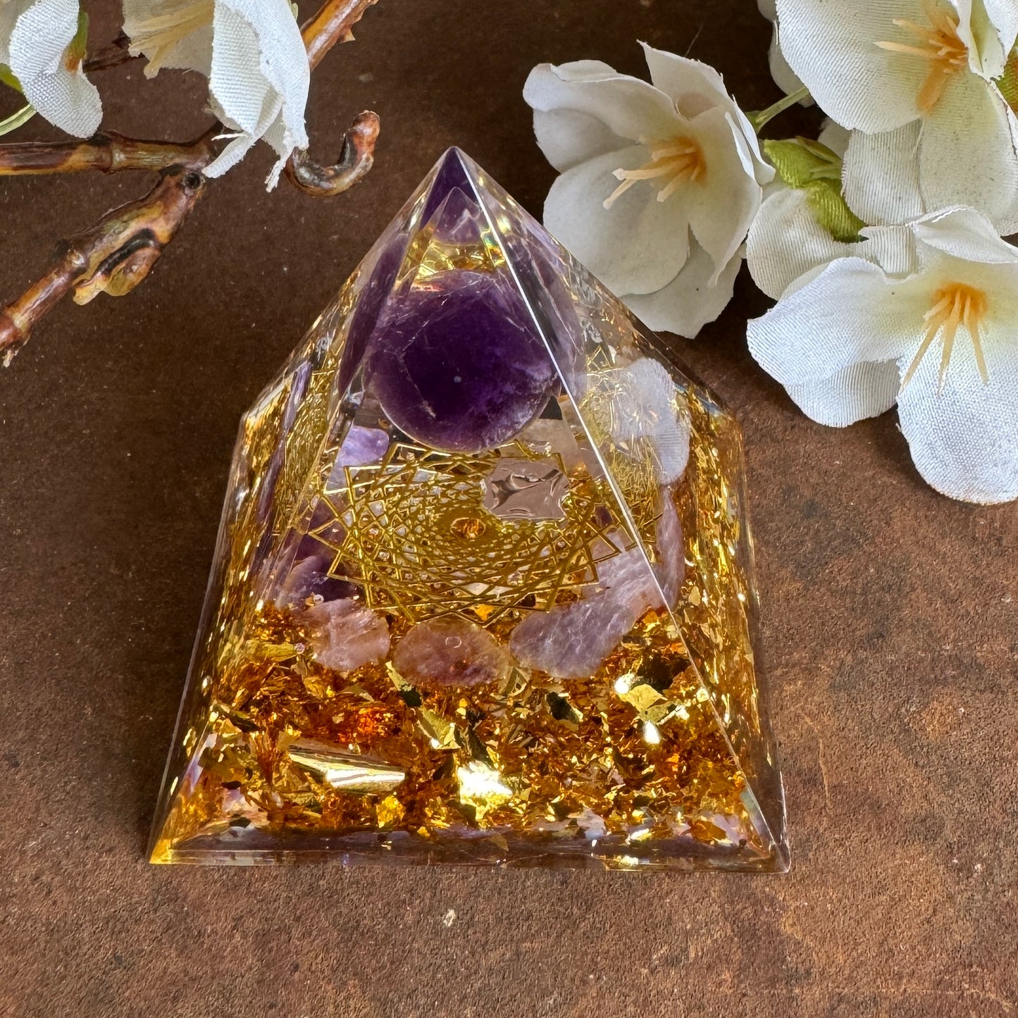 Amethyst orgonite pyramid with grid of life for energy balance, calm, clarity, and emotional healing