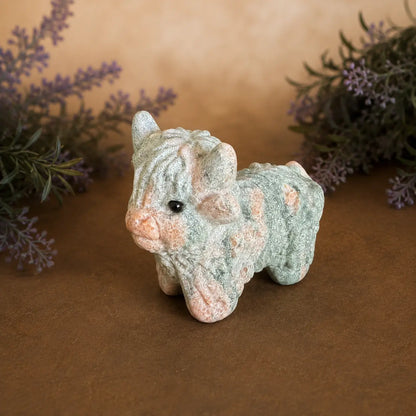 Pink Zebra Jasper Highland Cow crystal carving with  pink and grey banded patterns and hand-carved details