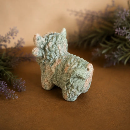 Pink Zebra Jasper Highland Cow crystal carving with pink and grey banded patterns and hand-carved details