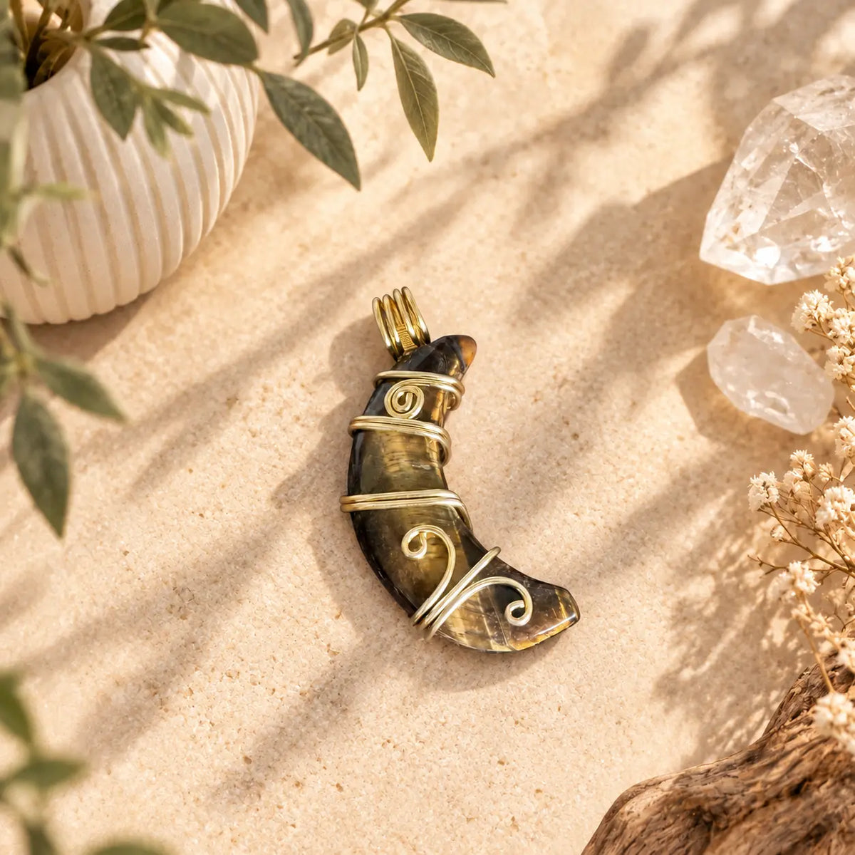 Tiger Eye moon pendant with loop, approximately 37mm, showing natural golden-brown chatoyancy.