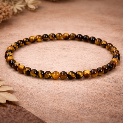 Tiger’s Eye spiritual bracelet with 4mm natural golden-brown crystal beads in a unisex stretch design.