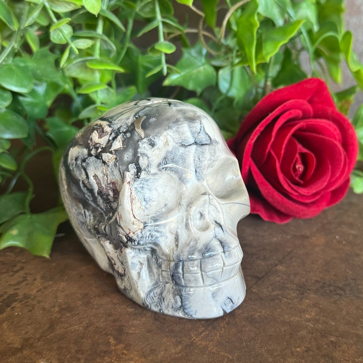 Hand-carved UV-reactive Volcanic Agate Skull 517g with green glow for spiritual protection, grounding, intuition, meditation, energy healing, and sacred décor