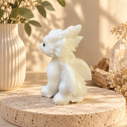 White Jade dragon carving side view with soft natural colouring