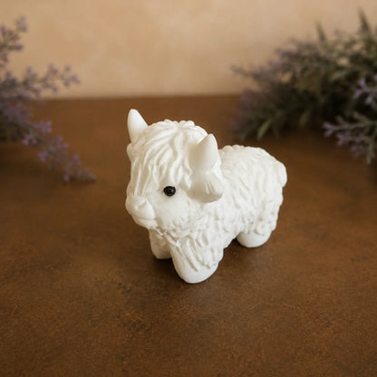 White Jade Highland Cow crystal carving with smooth pale tones and hand-carved details