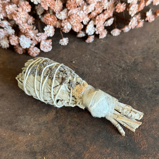 White Sage Torch Smudge Stick with Clear Quartz, Lavender, and wildflowers for energy cleansing, manifestation, calm, and spiritual protection.