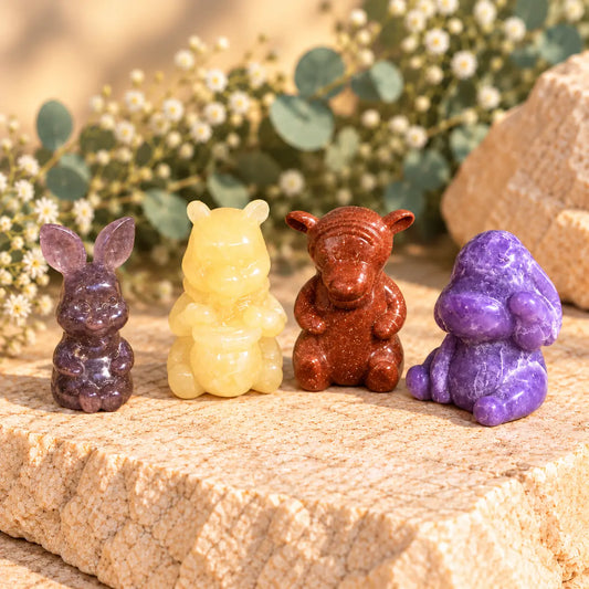 Winnie the Pooh-inspired crystal carving set with Orange Calcite, Goldstone, Strawberry Quartz and Lepidolite