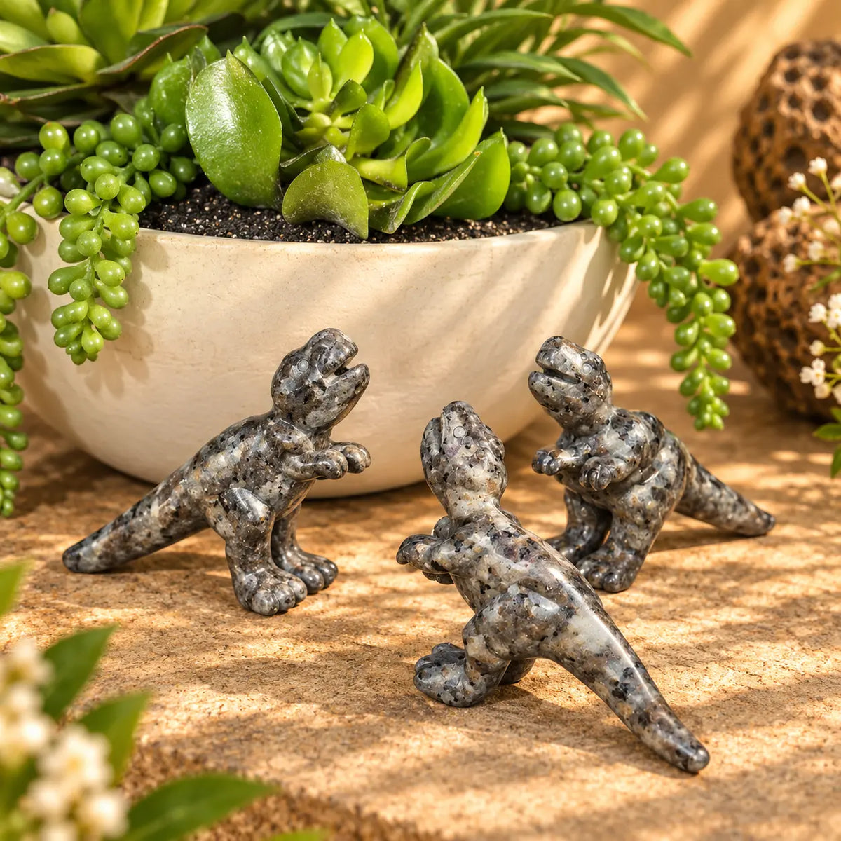 Yooperlite T-Rex dinosaur carvings displayed together