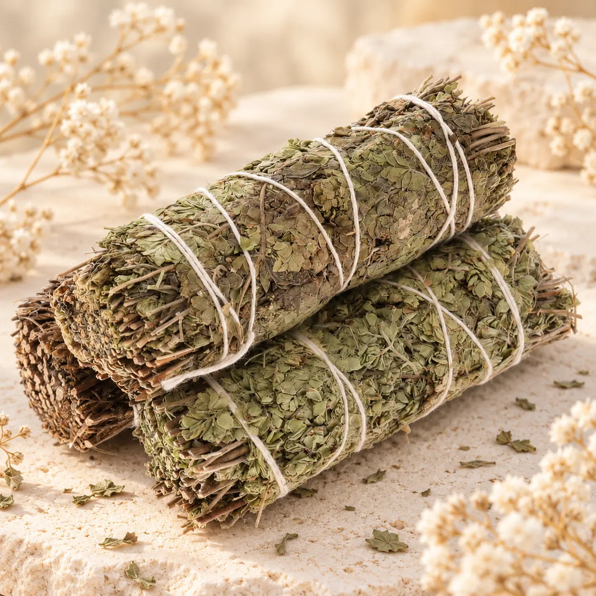 Oregano Sage Smudge Stick 10cm, hand-tied dried herbal cleansing bundle on a cream stone background